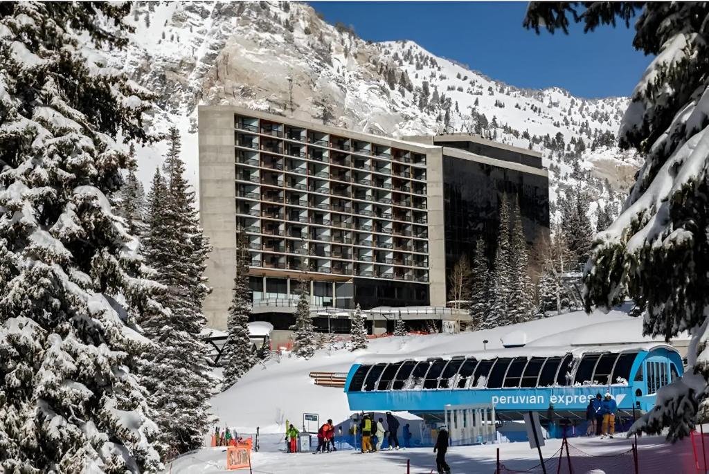 a blue train parked in front of a ski resort at Ski-In Ski-Out - The Cliff @ Snowbird in Sandy