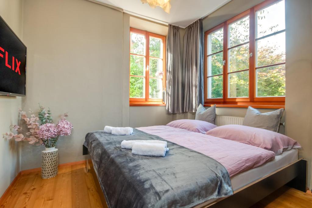 Ένα ή περισσότερα κρεβάτια σε δωμάτιο στο Gartenblick - Netflix - Free Parking - Waschmaschine - Zentral - Villa