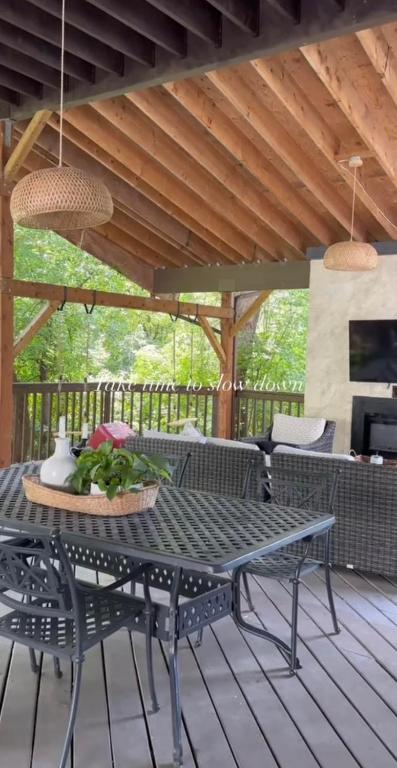 a patio with a table and chairs on a deck at No. 5 East in Winnipeg