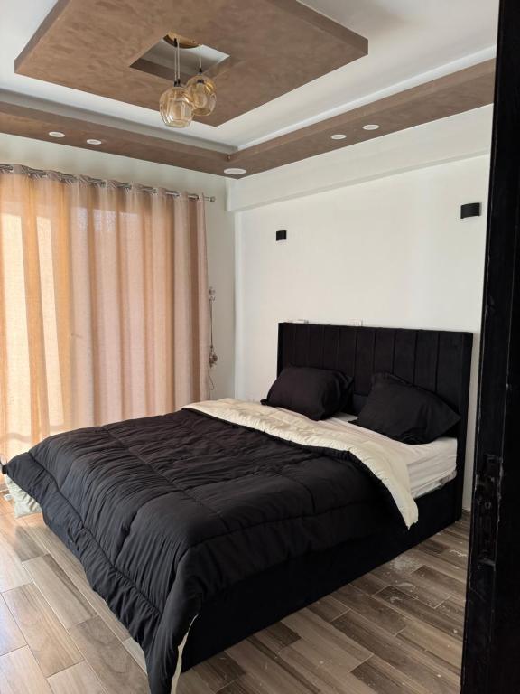 Postel nebo postele na pokoji v ubytování Apartment in jannet zayed 2