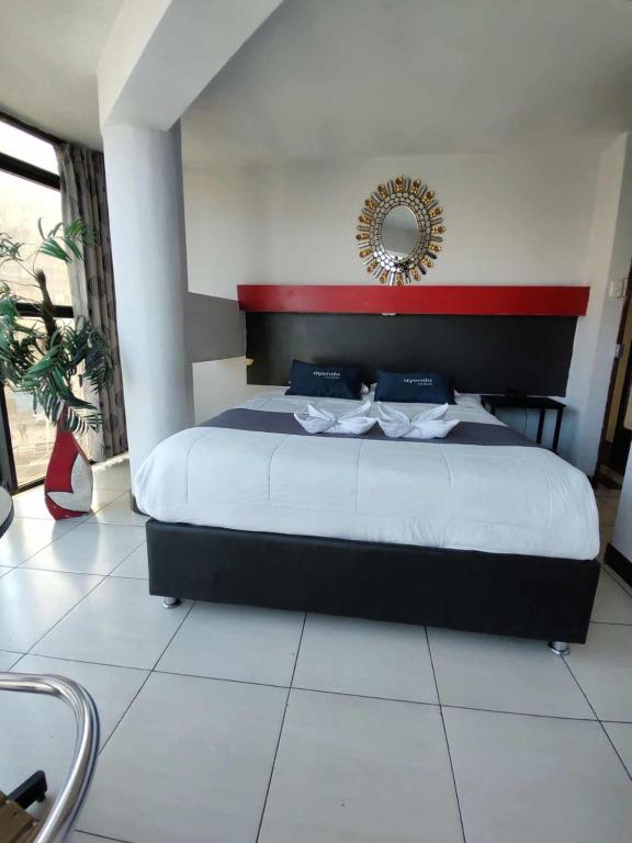 Postel nebo postele na pokoji v ubytování Hotel Platinum Palace