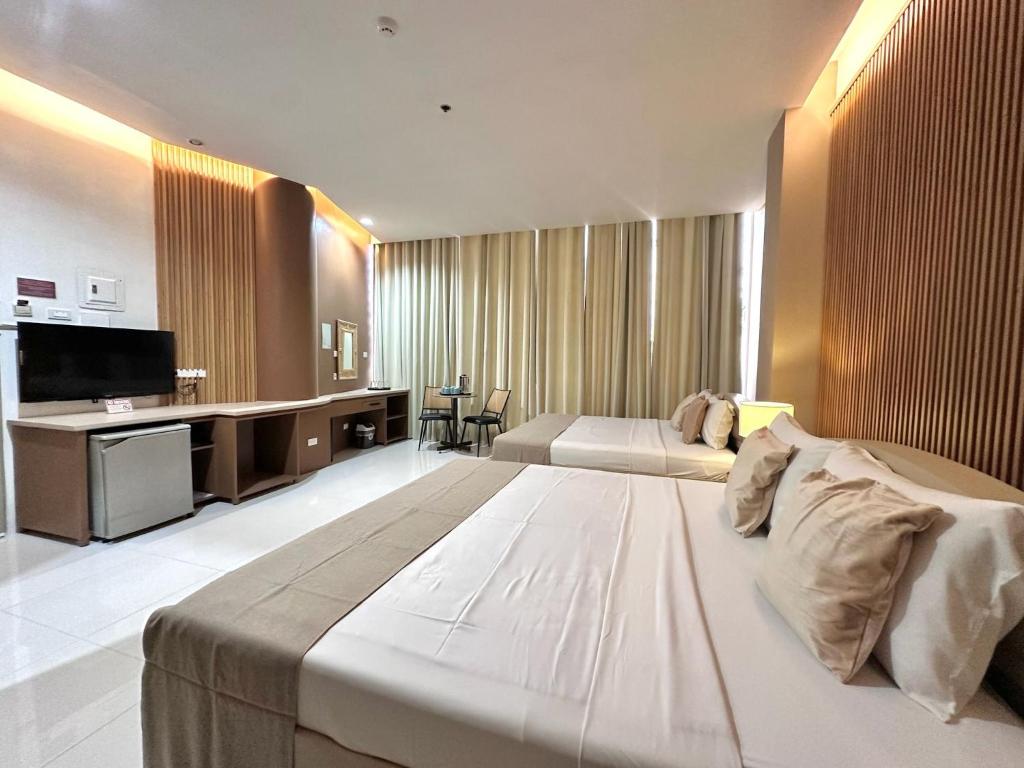 Postel nebo postele na pokoji v ubytování Hotel Nicanor