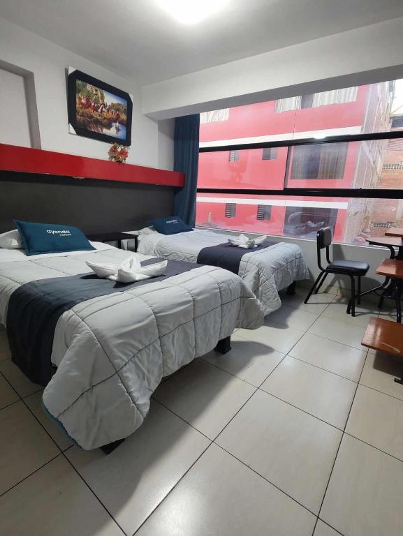 Postel nebo postele na pokoji v ubytování Hotel Platinum Palace