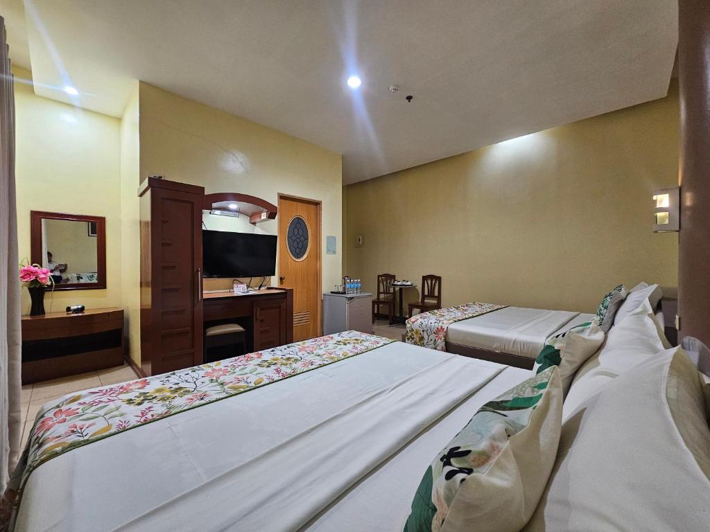 Postel nebo postele na pokoji v ubytování Hotel Nicanor