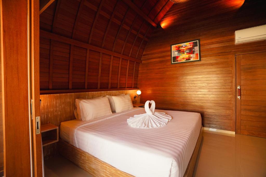 Postel nebo postele na pokoji v ubytování Uma Mani Villa Bali