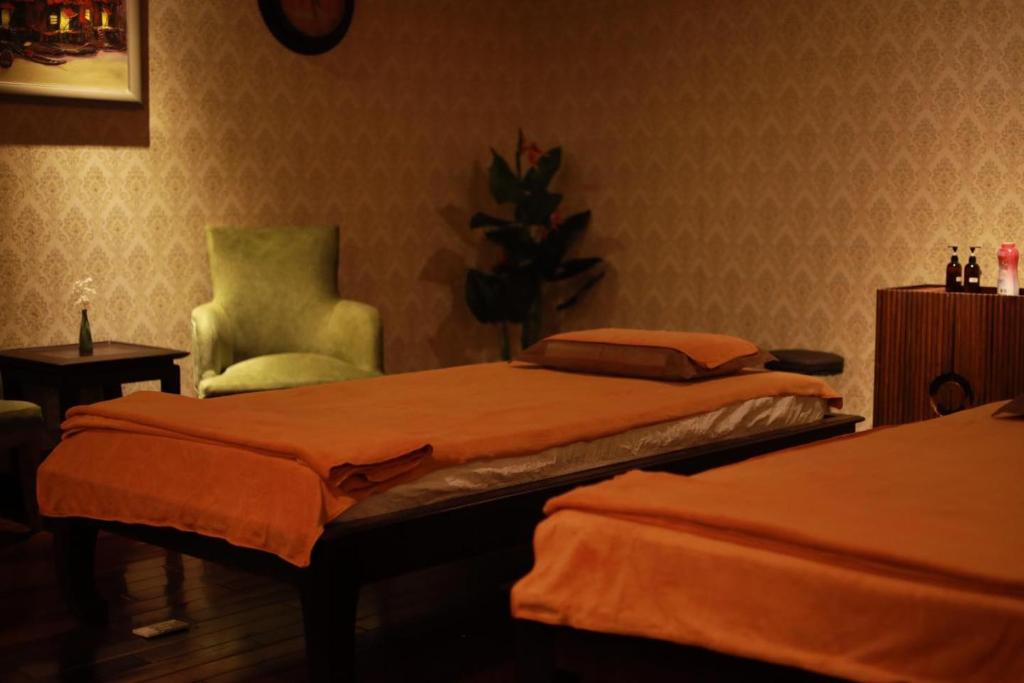 Giường trong phòng chung tại TTC Imperial Hotel