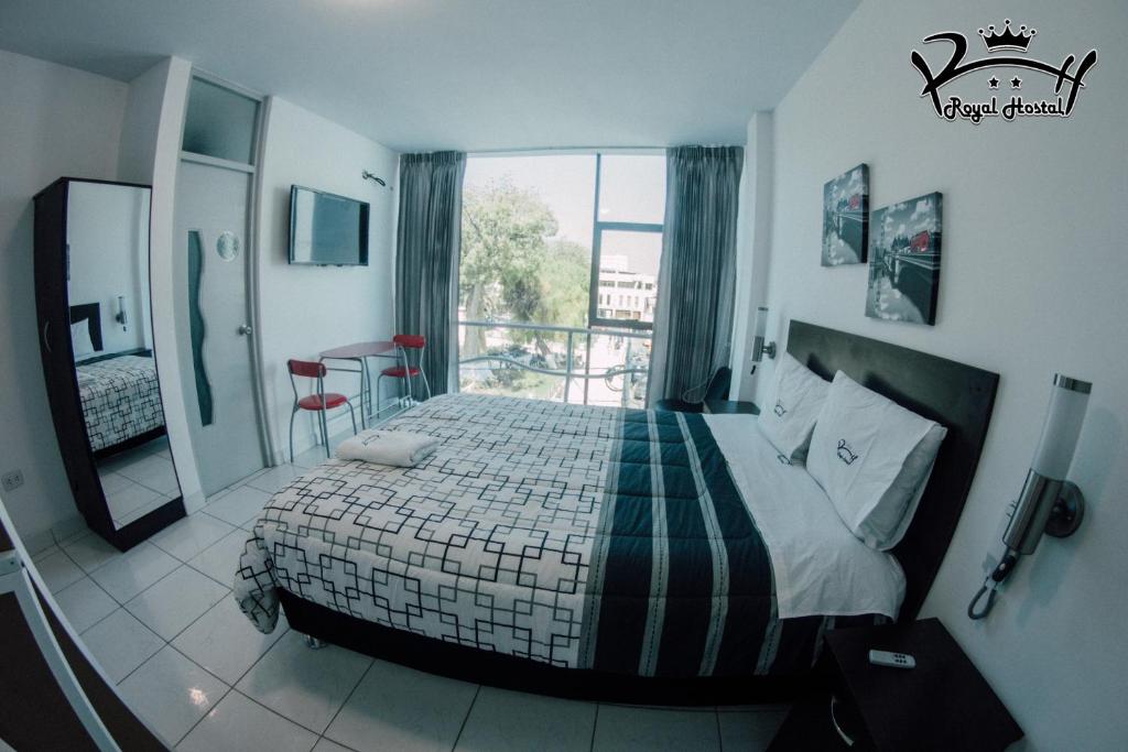 Ένα ή περισσότερα κρεβάτια σε δωμάτιο στο Hostal Royal