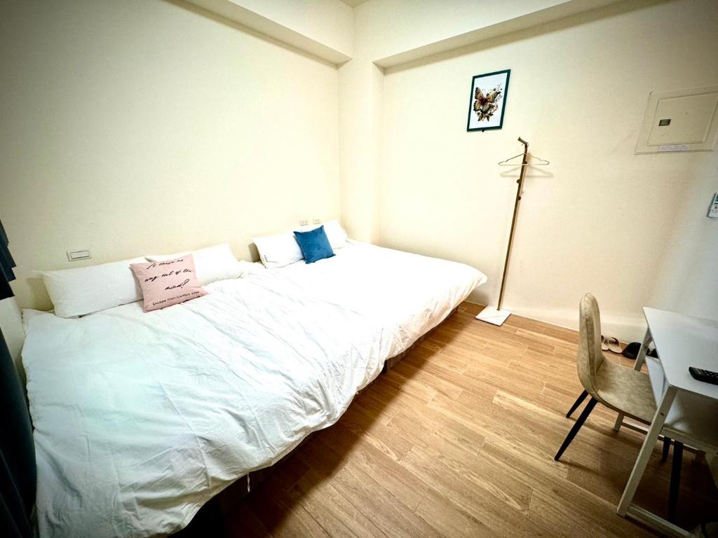 Postel nebo postele na pokoji v ubytování Huatian B&B