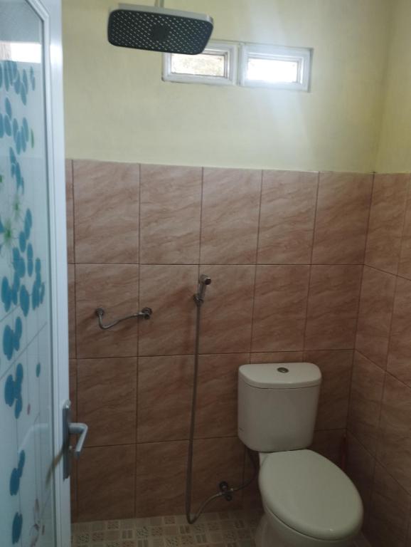 Koupelna v ubytování Hasbi Homestay Syariah