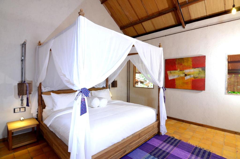 Postel nebo postele na pokoji v ubytování Desa Alamanis Resort Villa