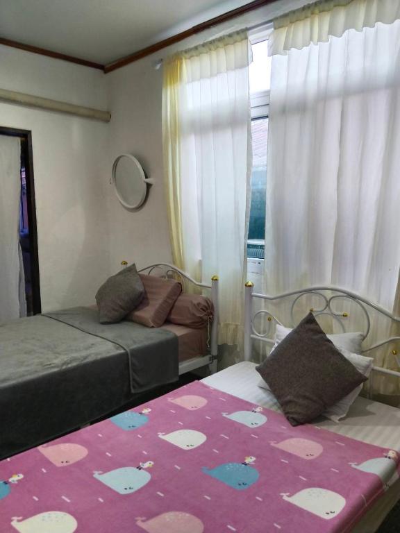 Postel nebo postele na pokoji v ubytování Tiki Bar-KanTiang Guesthouse