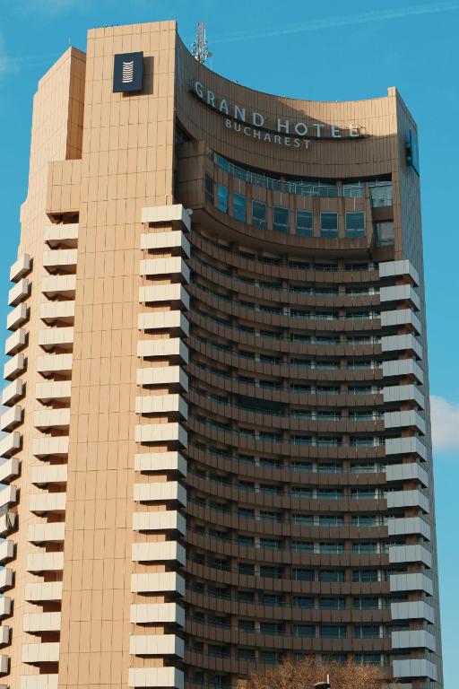 a building with a sign on the top of it at Grand Hotel Bucharest in Bucharest