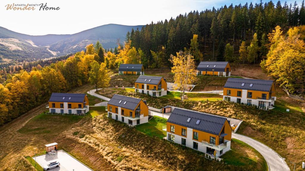 an aerial view of a home in the mountains at Wonder Home Myśliwska - Domki przy stoku Karpatka - na terenie kompleksu plac zabaw, zewnętrzna siłownia i sklep in Karpacz