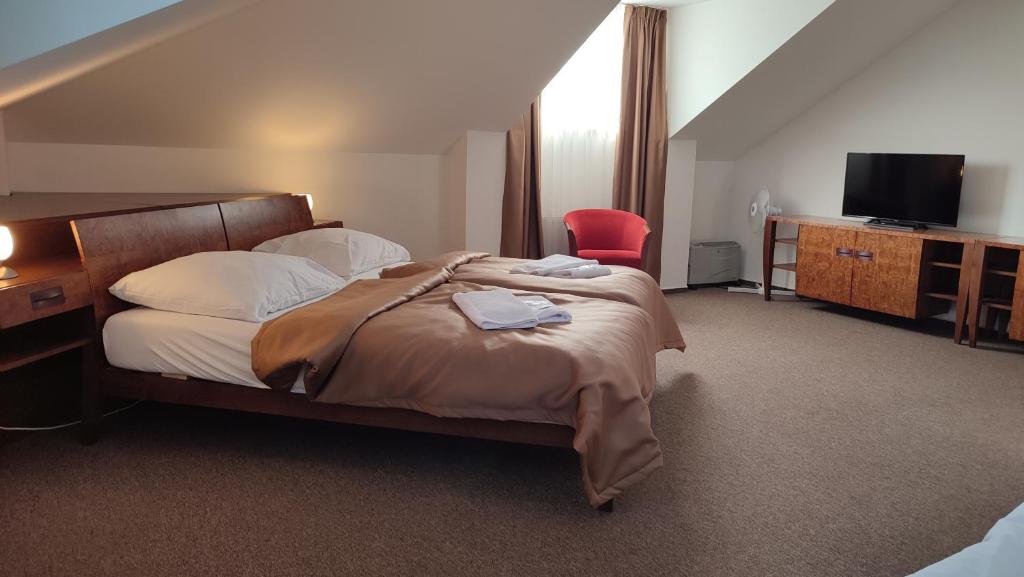Postel nebo postele na pokoji v ubytování Hotel Vion