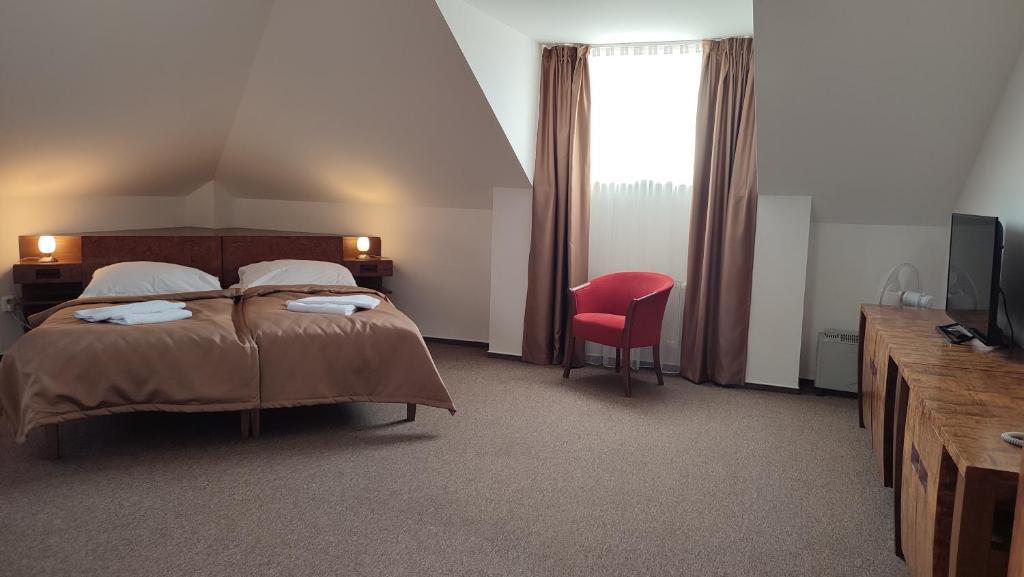Postel nebo postele na pokoji v ubytování Hotel Vion