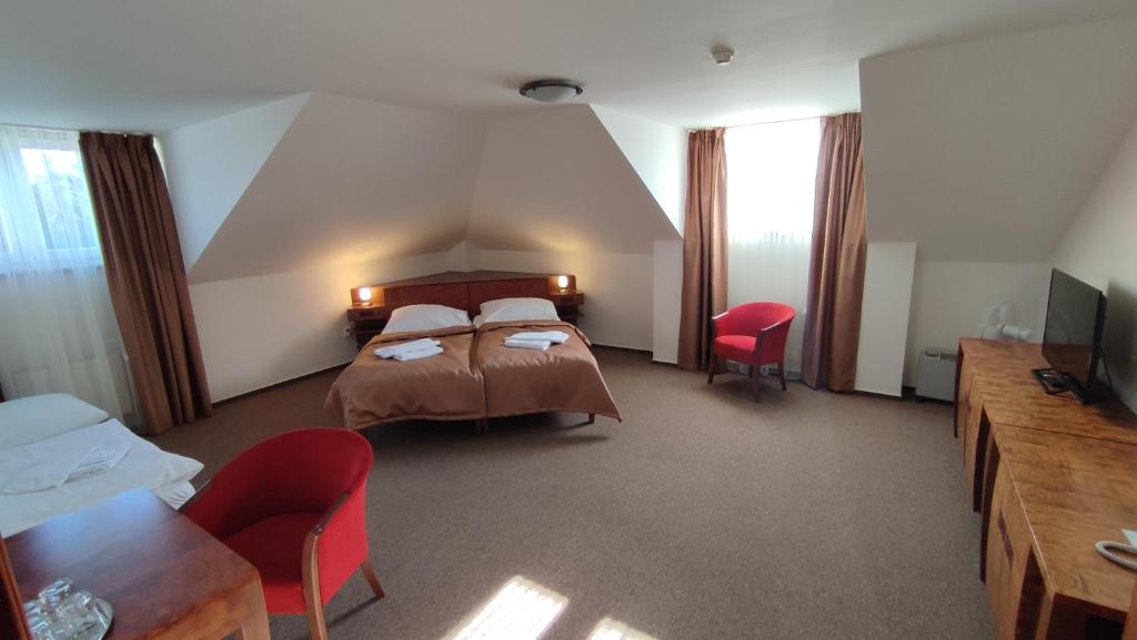 Postel nebo postele na pokoji v ubytování Hotel Vion