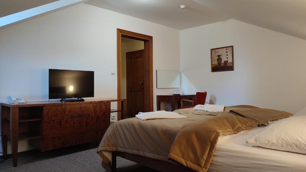 Postel nebo postele na pokoji v ubytování Hotel Vion