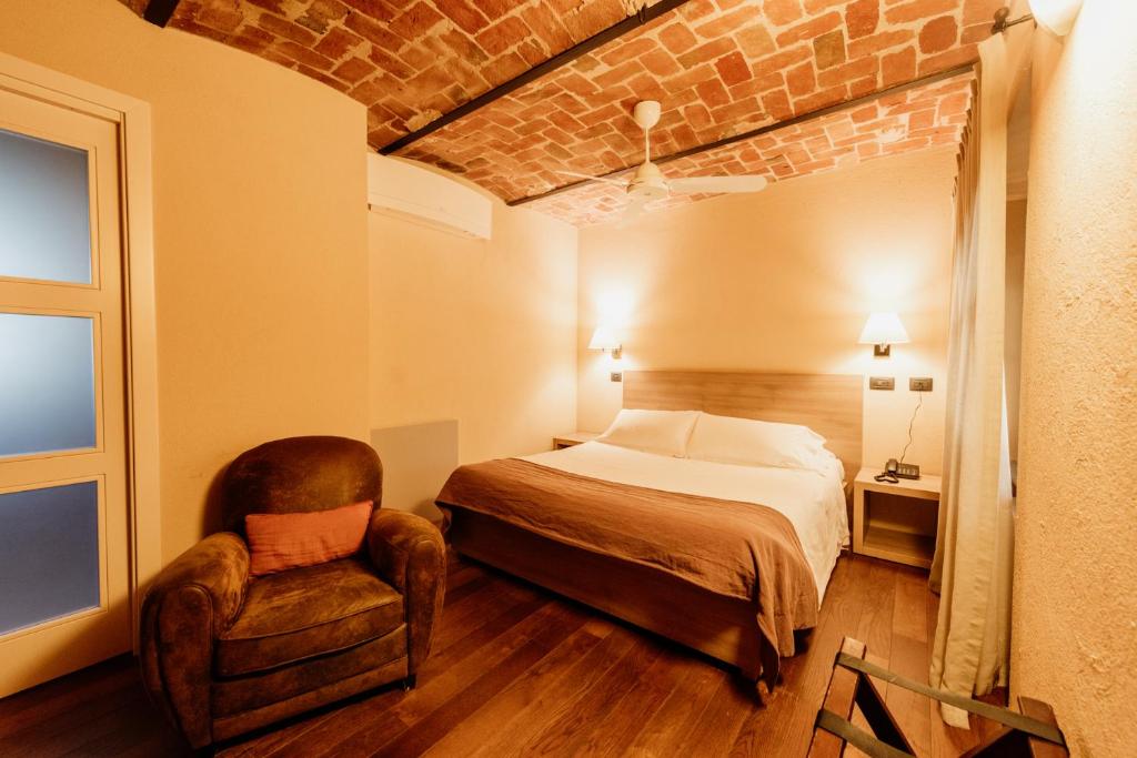 Postel nebo postele na pokoji v ubytování I Tre Poggi Dimora di Charme