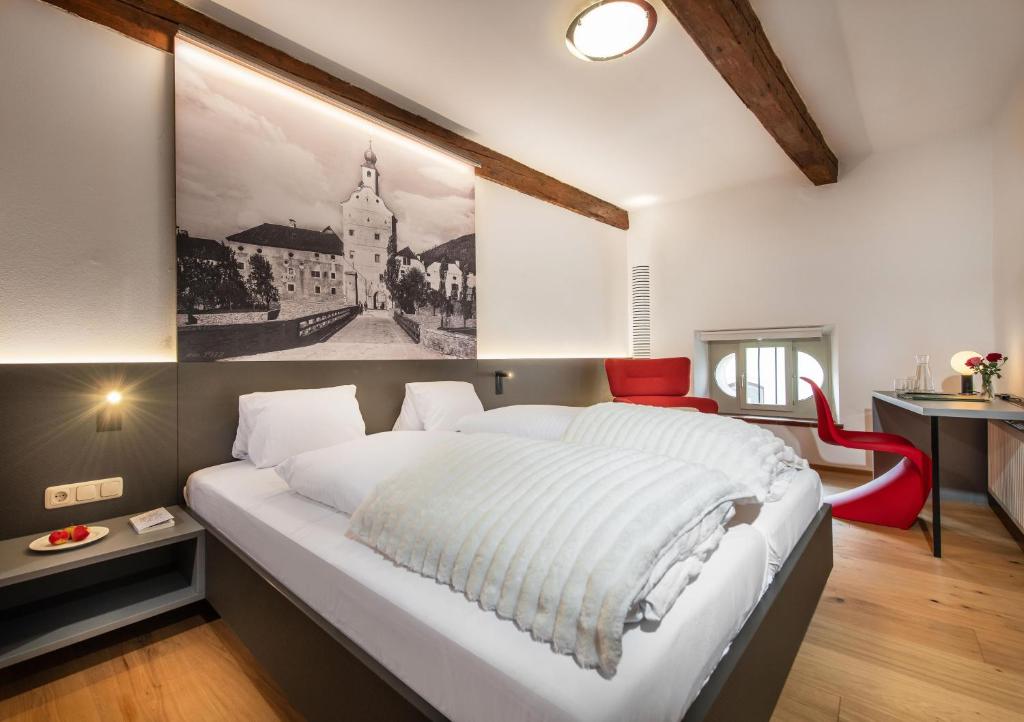 Postel nebo postele na pokoji v ubytování Hotel Gasthof Prunner