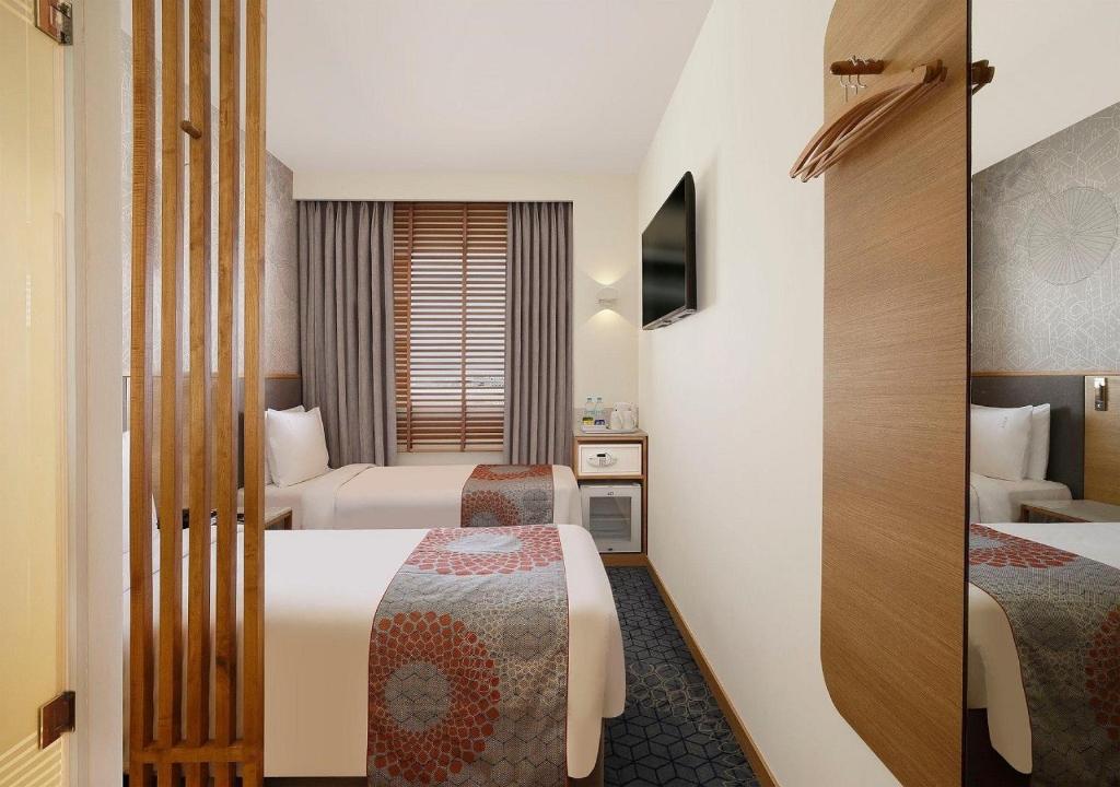 Postel nebo postele na pokoji v ubytování Holiday Inn Express Greater Noida Knowledge Park by IHG