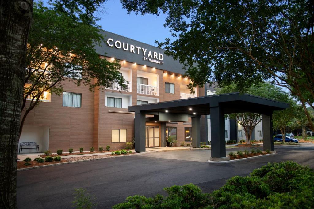 a building with a black canopy in front of it at Courtyard Lafayette Airport in Lafayette