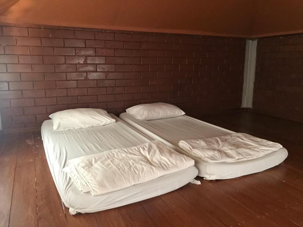 Postel nebo postele na pokoji v ubytování Rachavadee Bankrut Resort