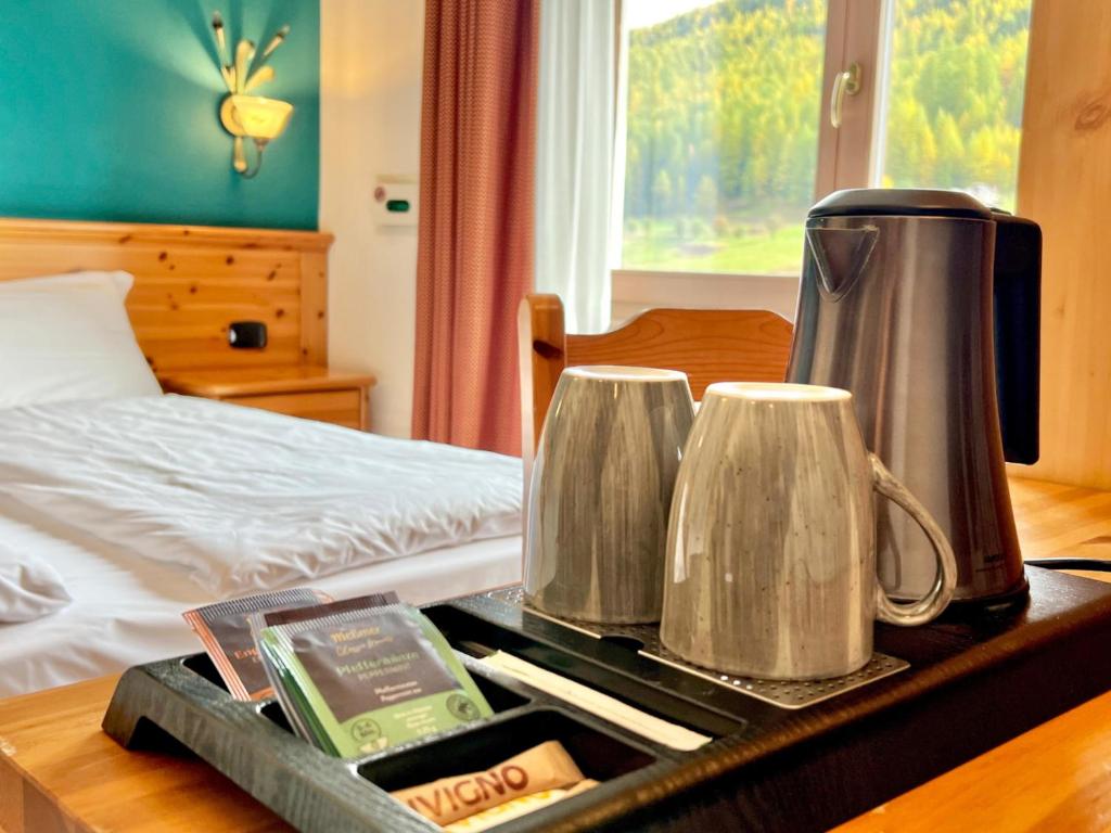 Postel nebo postele na pokoji v ubytování Hotel Primula