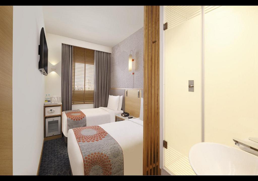 Postel nebo postele na pokoji v ubytování Holiday Inn Express Greater Noida Knowledge Park by IHG