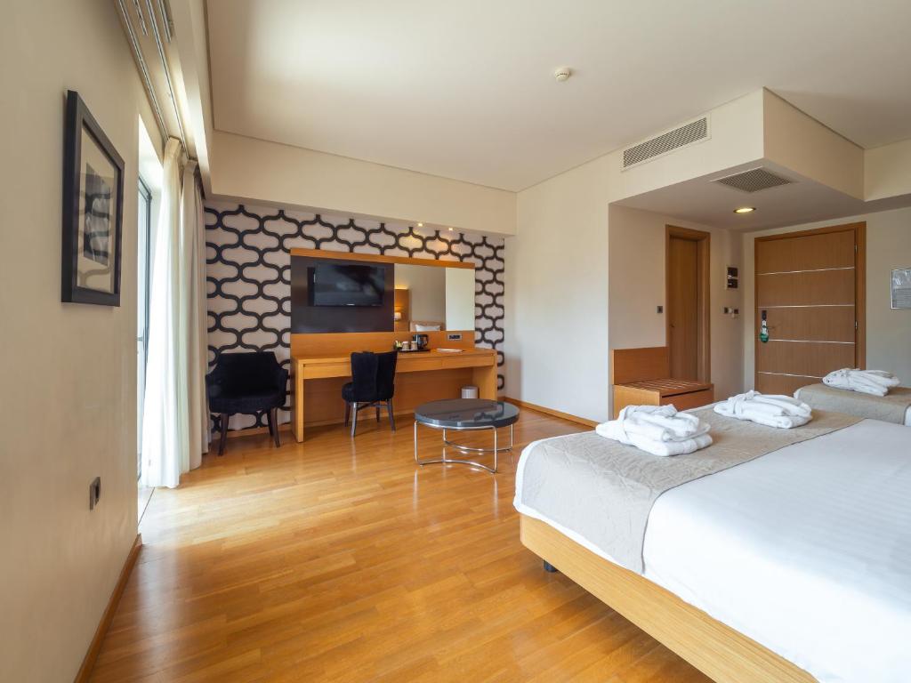 Postel nebo postele na pokoji v ubytování Elektra Hotel & Spa