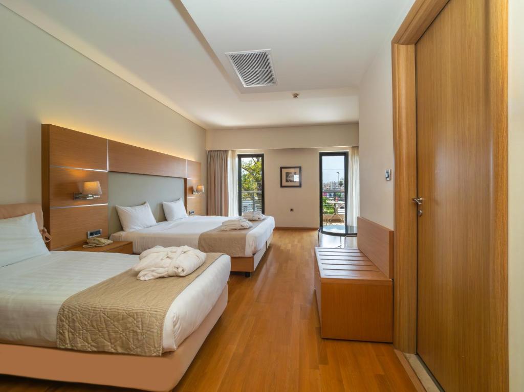 Postel nebo postele na pokoji v ubytování Elektra Hotel & Spa