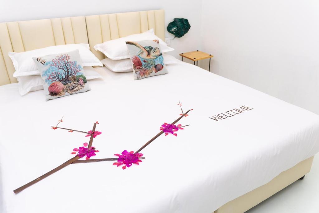 Postel nebo postele na pokoji v ubytování Fasdheythere Inn Maldives