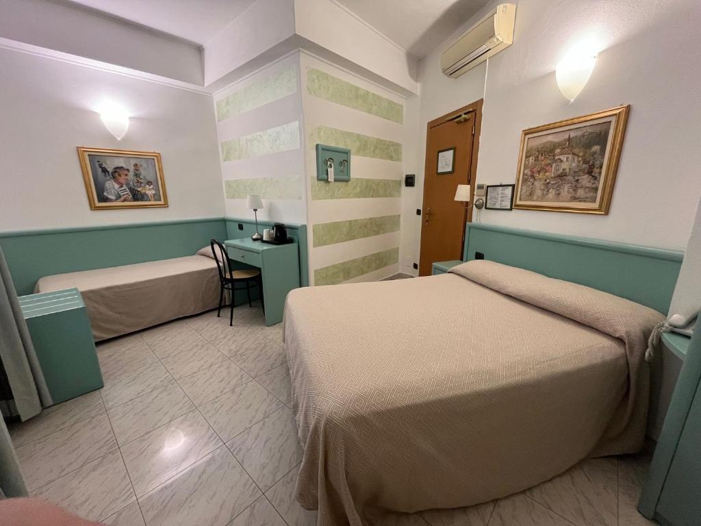 Postel nebo postele na pokoji v ubytování Hotel Marina
