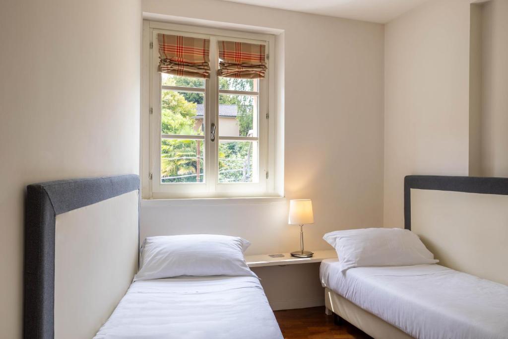 Postel nebo postele na pokoji v ubytování Resort Antico Verbano