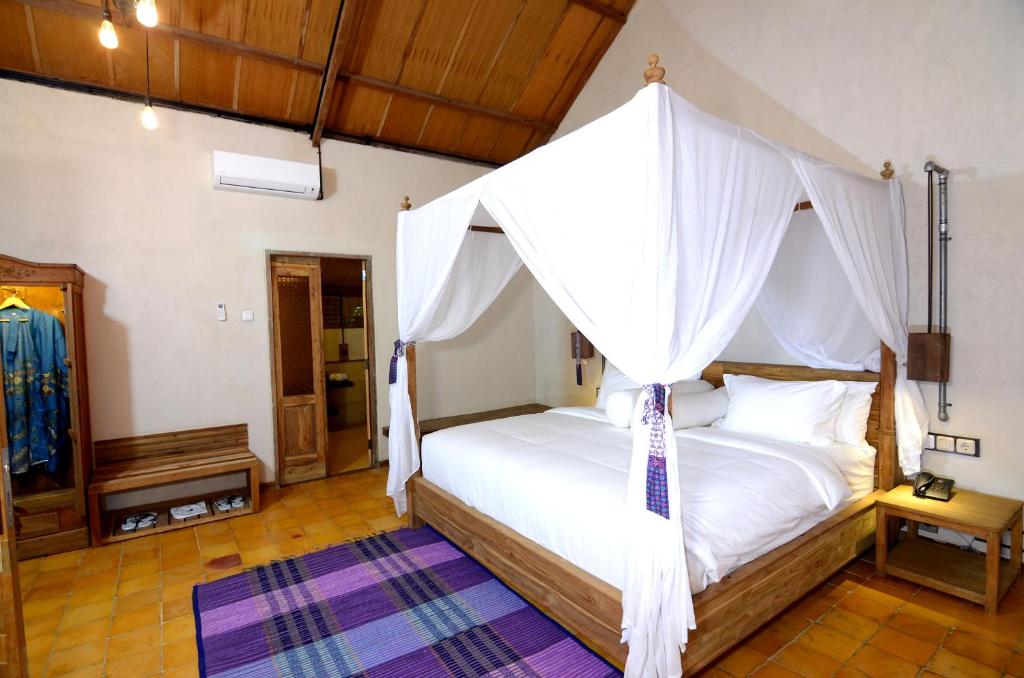 Postel nebo postele na pokoji v ubytování Desa Alamanis Resort Villa