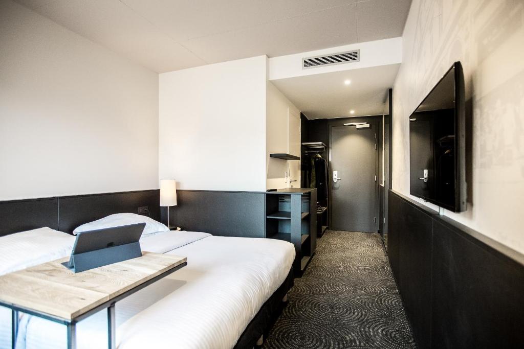 Postel nebo postele na pokoji v ubytování Hotel Van Belle