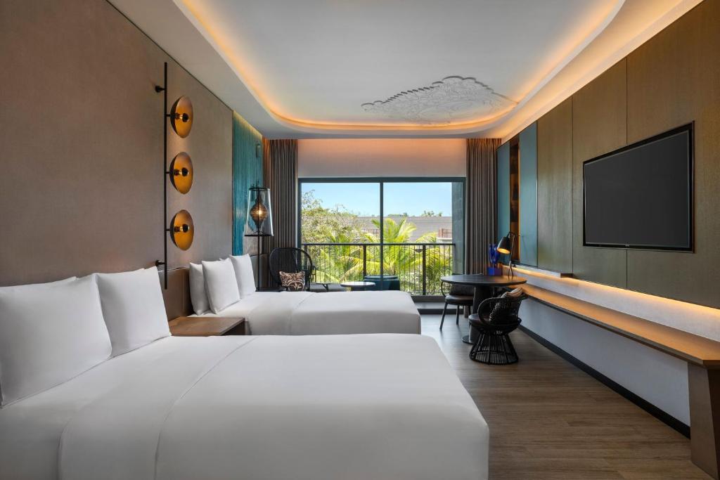 Postel nebo postele na pokoji v ubytování Renaissance Bali Nusa Dua Resort