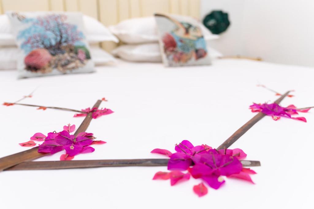 Postel nebo postele na pokoji v ubytování Fasdheythere Inn Maldives