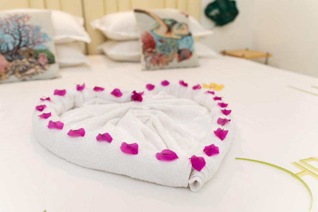 Postel nebo postele na pokoji v ubytování Fasdheythere Inn Maldives