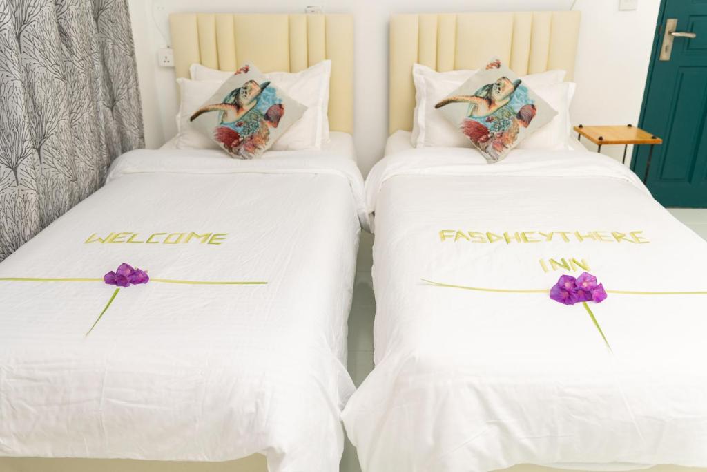 Postel nebo postele na pokoji v ubytování Fasdheythere Inn Maldives