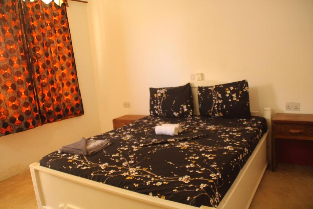 Postel nebo postele na pokoji v ubytování Raphy Home