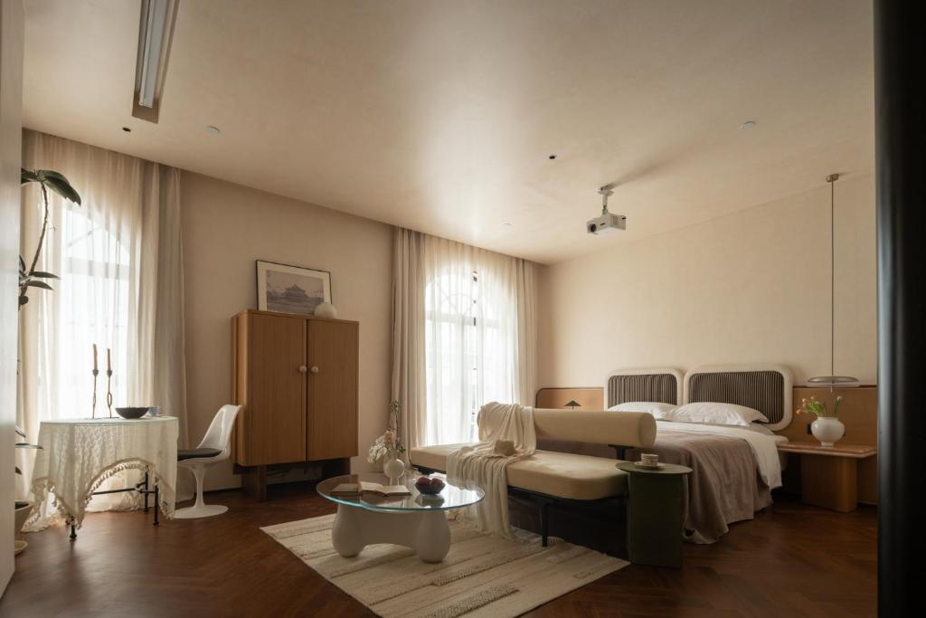 Postel nebo postele na pokoji v ubytování 归相Golden Age酒店
