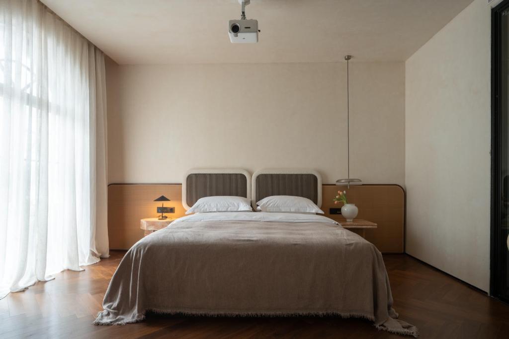 Postel nebo postele na pokoji v ubytování 归相Golden Age酒店