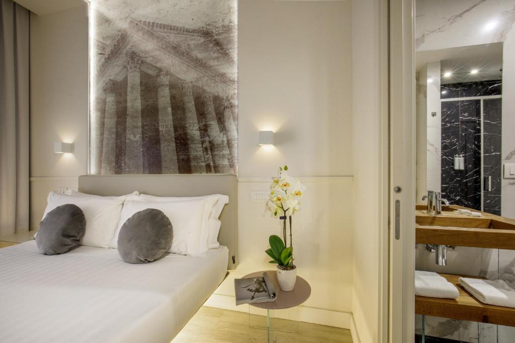 Postel nebo postele na pokoji v ubytování Hotel Regno