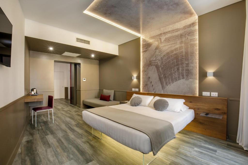 Postel nebo postele na pokoji v ubytování Hotel Regno