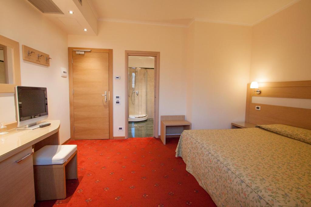 Cama o camas de una habitación en Hotel Laurentia