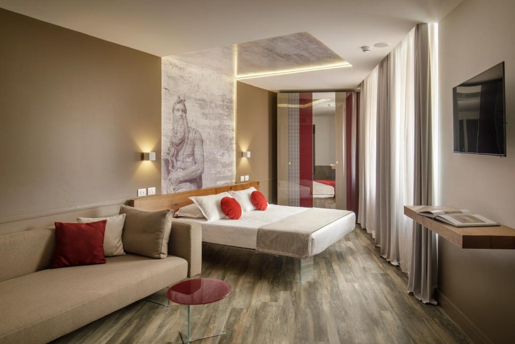 Postel nebo postele na pokoji v ubytování Hotel Regno