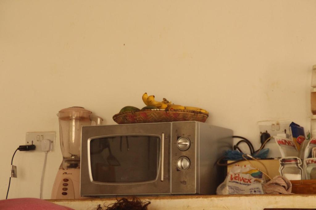Kuchyň nebo kuchyňský kout v ubytování Raphy Home