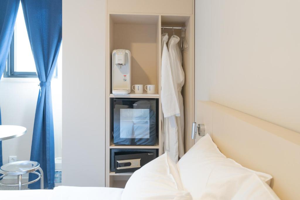 Postel nebo postele na pokoji v ubytování Hotel Myeongdongjang