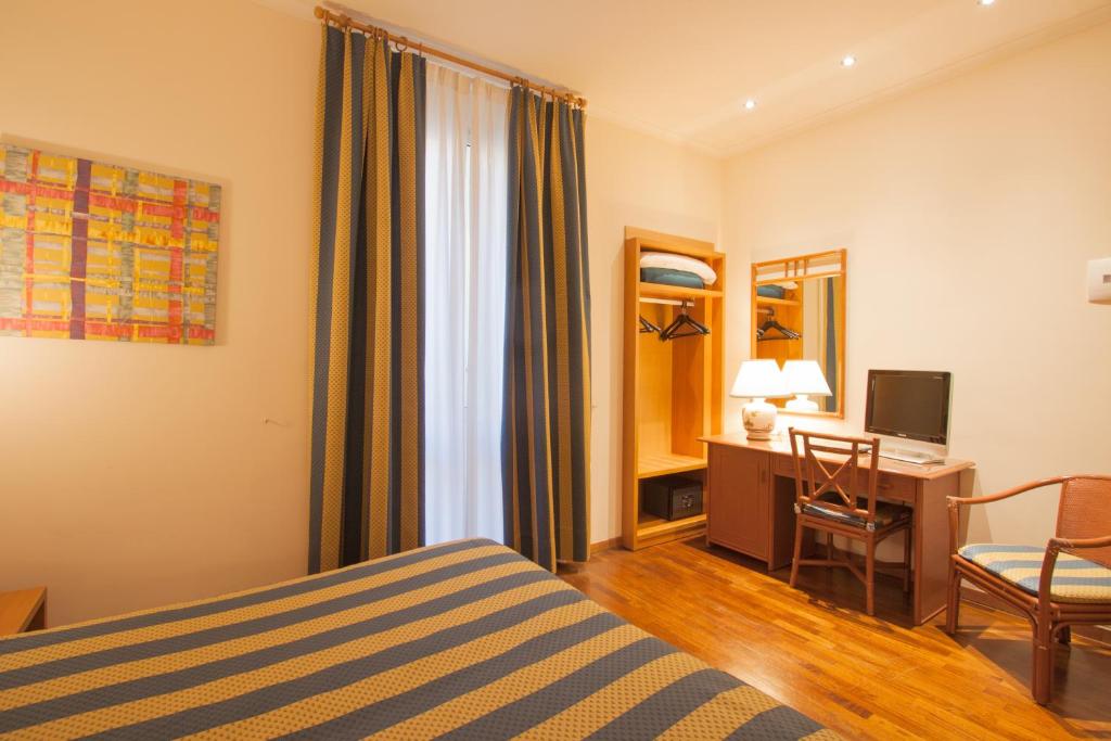 Cama o camas de una habitación en Hotel Laurentia
