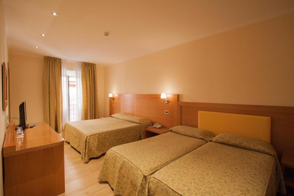 Cama o camas de una habitación en Hotel Laurentia